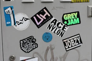 Artistic sticker pack laid out on a clean white surface with local Rochester icons.