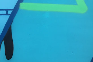 Abstract geometric background with electric blue lines on a deep charcoal backdrop.