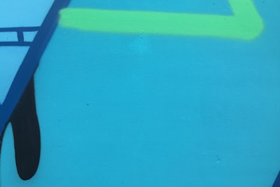 Abstract geometric data visualization with electric cyan and lime accents on a dark background.