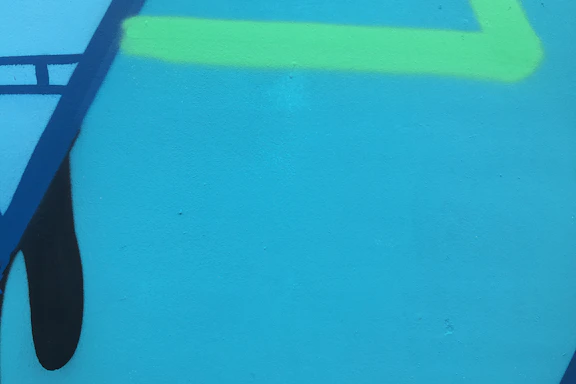 Abstract blue and gray geometric shapes forming a clean, professional background.