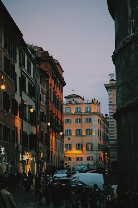 people walking on street between buildings during daytime in Pantheon Italy