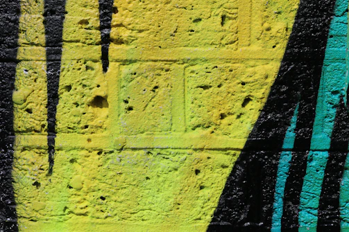 A detailed shot of a painted urban scene with bold colors and diagonal lines