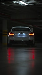white car on road during night time