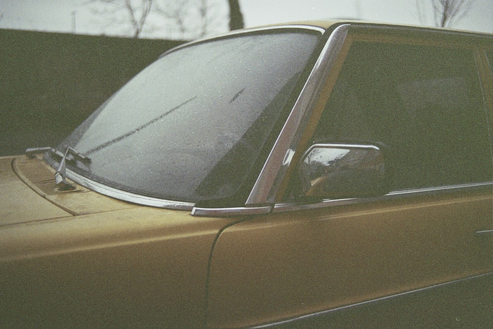 yellow car on snow covered ground during daytime