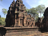An ancient tribal temple nestled among tall trees, showcasing Jharkhand's rich cultural heritage.
