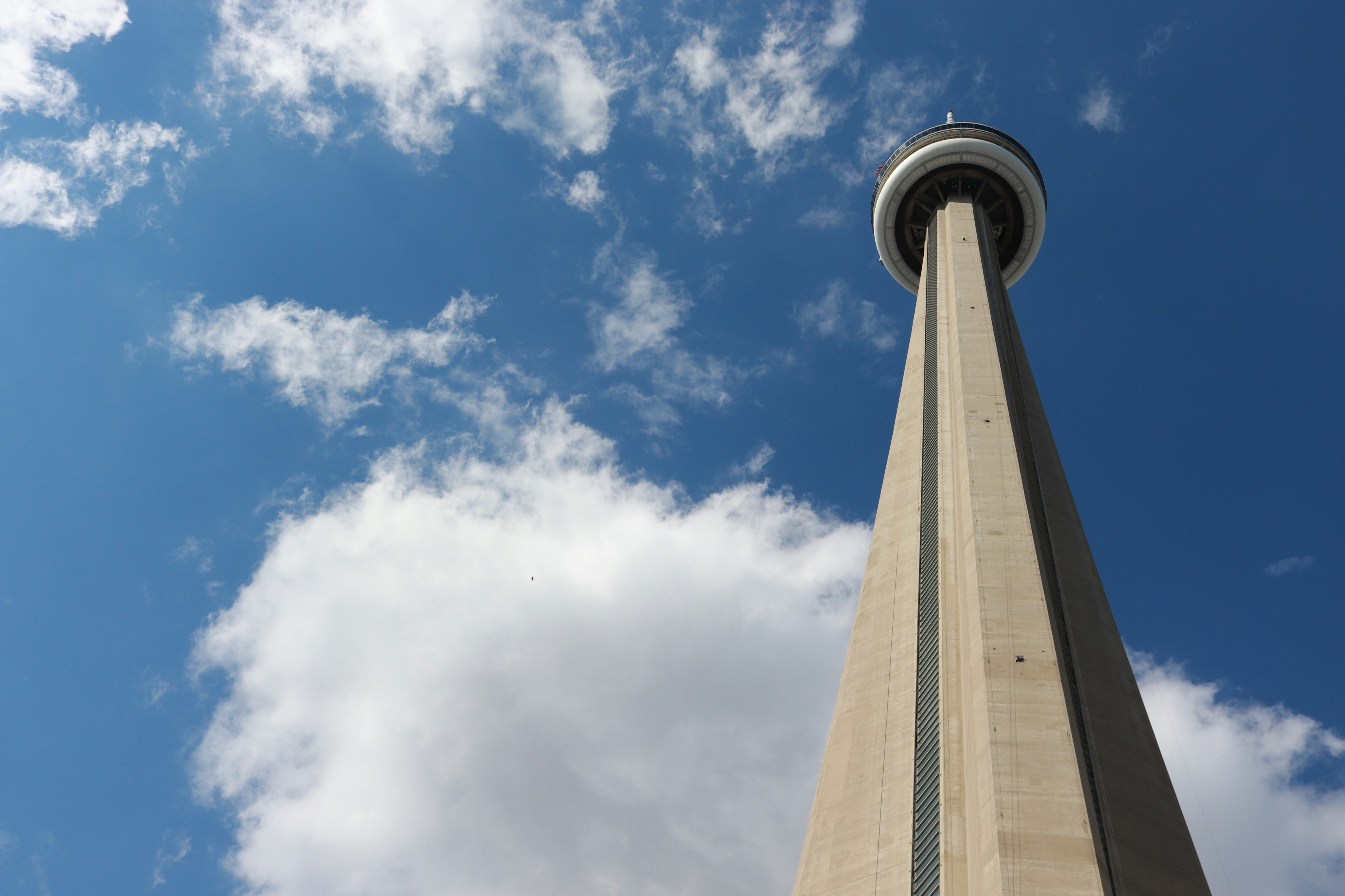 low angle photography of high rise building under blue sky during daytime
