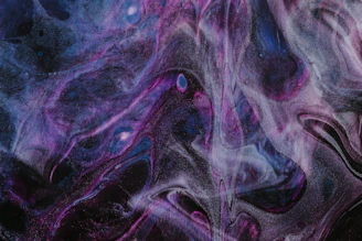 A dark indigo galaxy swirling with warm gold and amethyst stars, hinting at an epic sci-fi fantasy adventure.