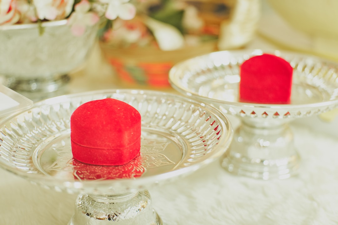 red heart shaped cake on clear glass cake stand