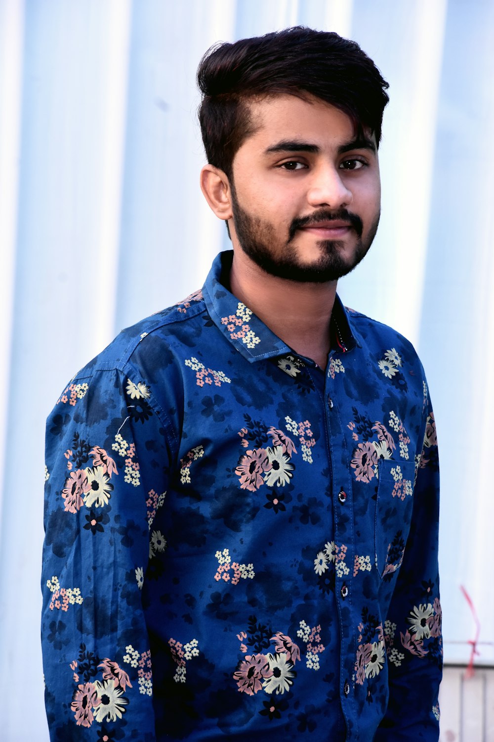 man in blue and white floral button up shirt