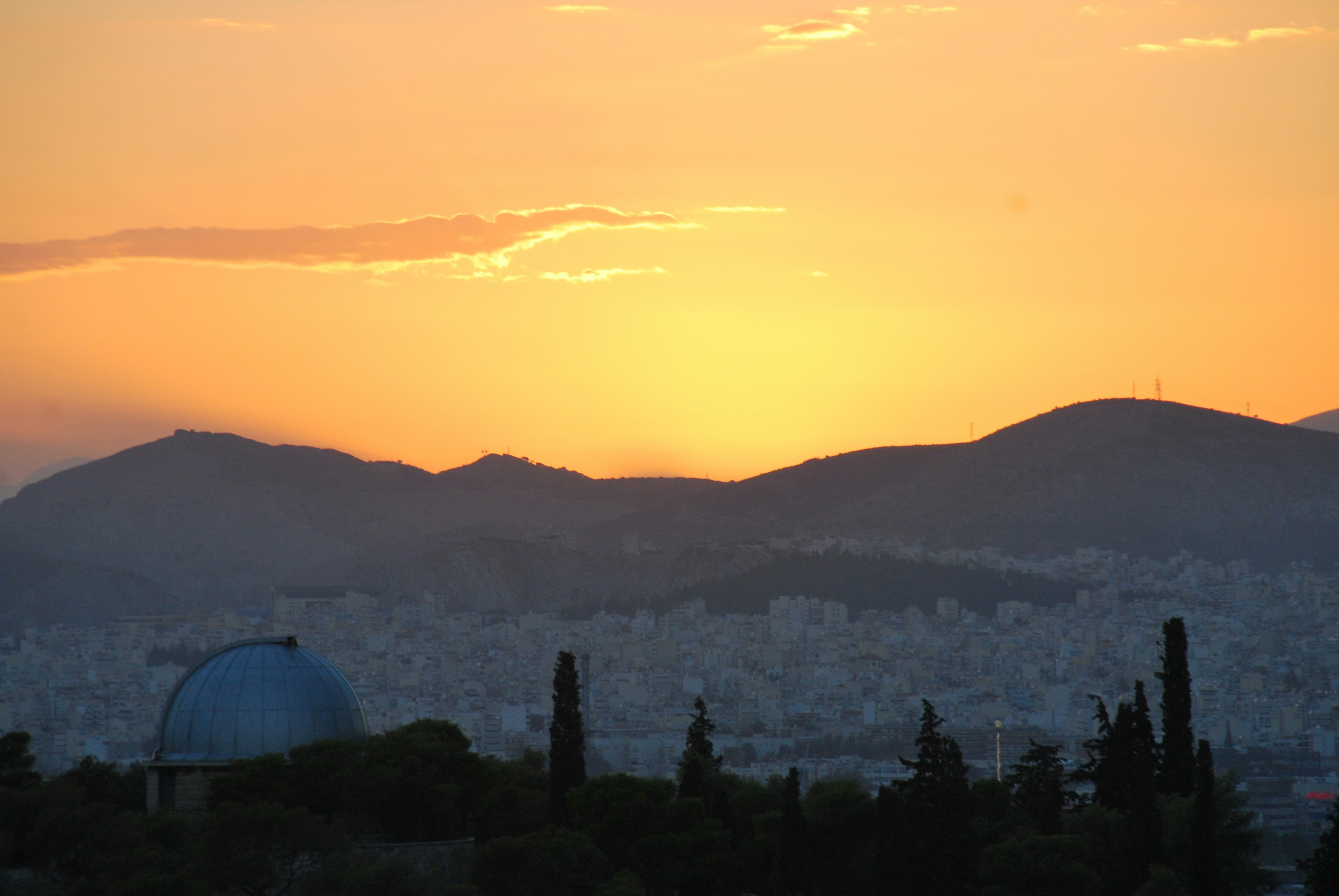 green trees near mountain during daytime