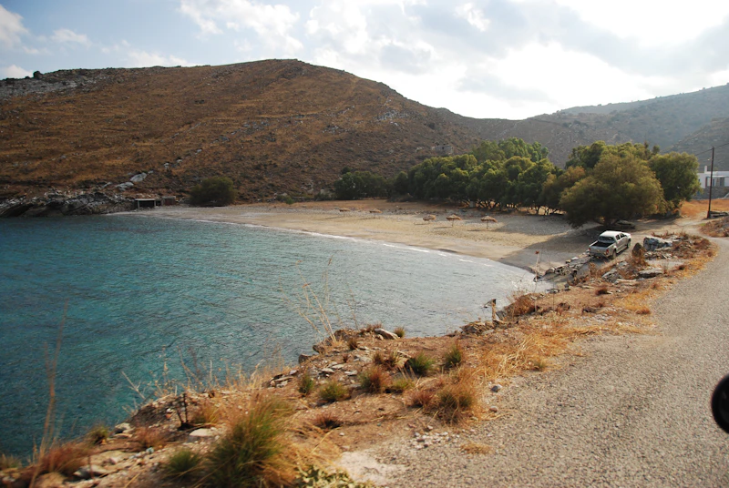 Dramatic hillside meeting the Aegean sea on the Paros coastline