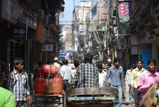 Shopfront view of Shahzain LPG Gas & Cylinder Shop bustling with local customers in Lake City Lahore.