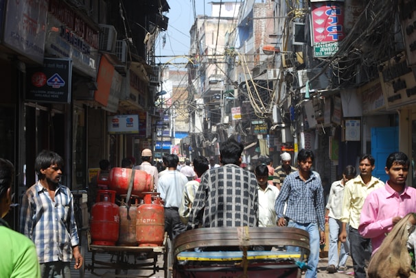 Shopfront view of Shahzain LPG Gas & Cylinder Shop bustling with local customers in Lake City Lahore.