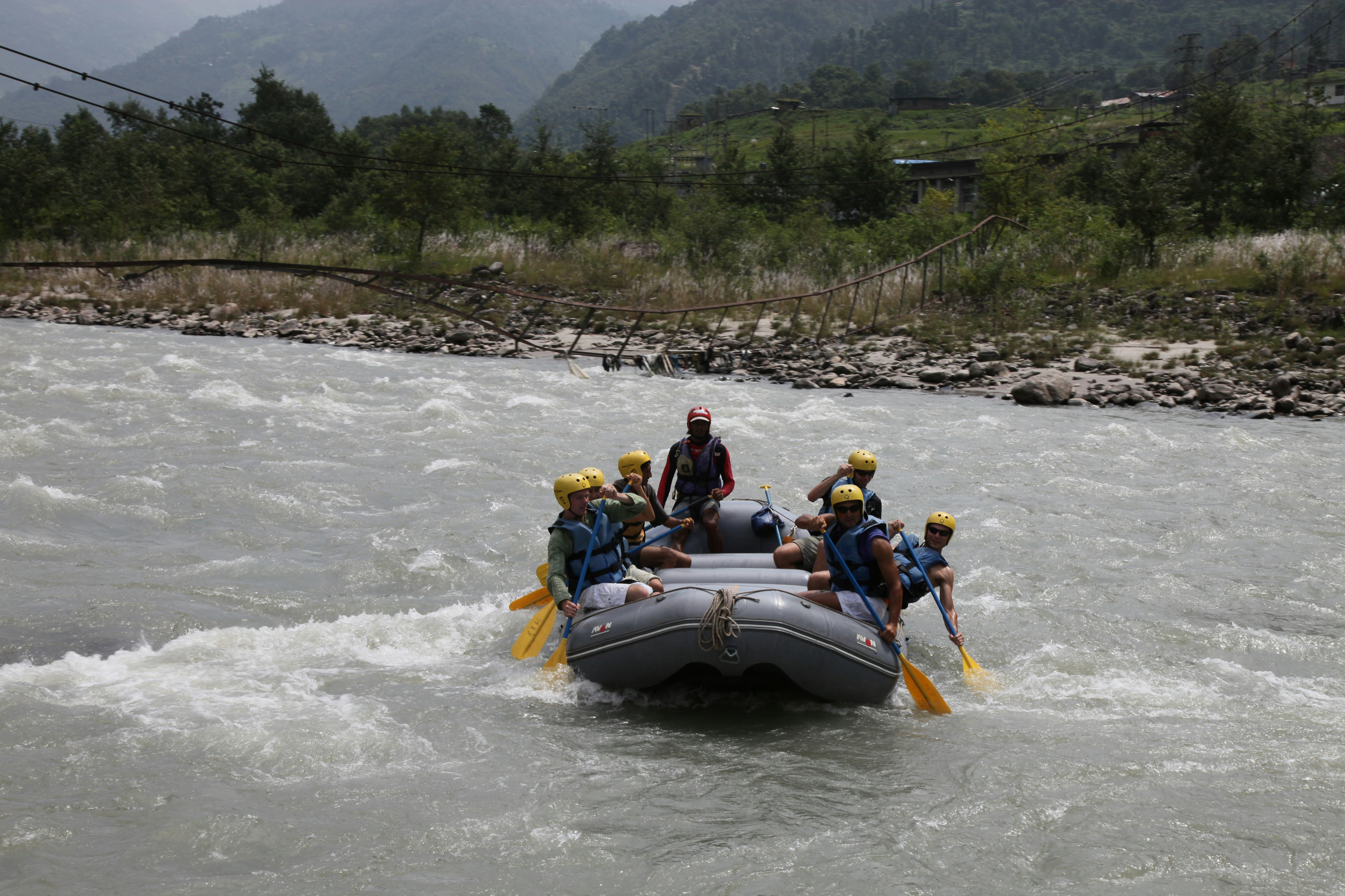 people white-water rafting down a river - Adventure weekend breaks