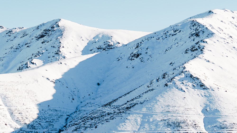 snow covered mountain during daytime