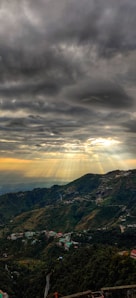 green and brown mountains under white clouds during daytime