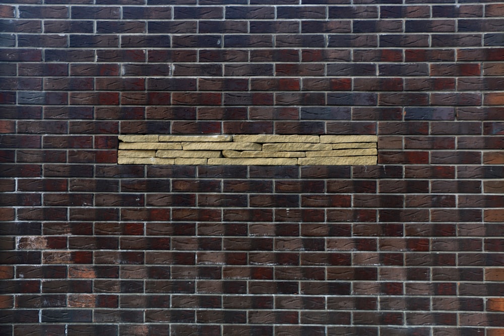 brown brick wall with brown wooden frame