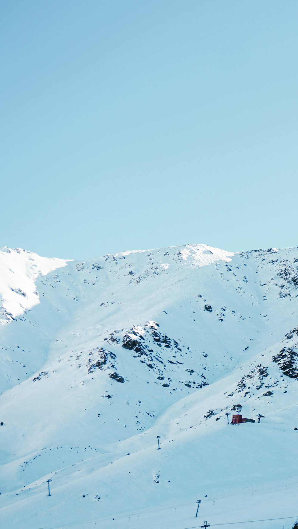 snow covered mountain under blue sky during daytime