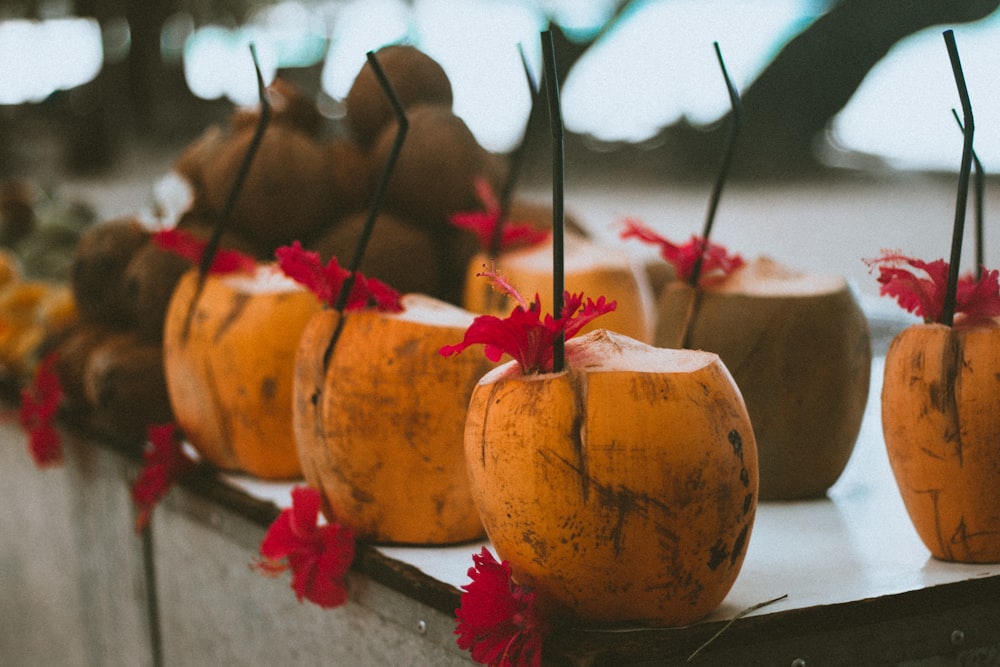 yellow and red pumpkin on white table