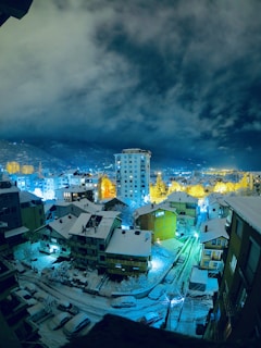 city skyline under blue and white cloudy sky during daytime