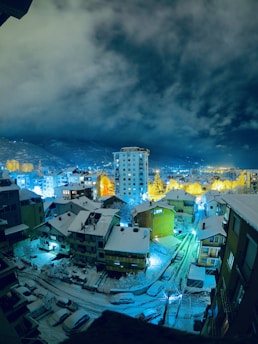 city skyline under blue and white cloudy sky during daytime