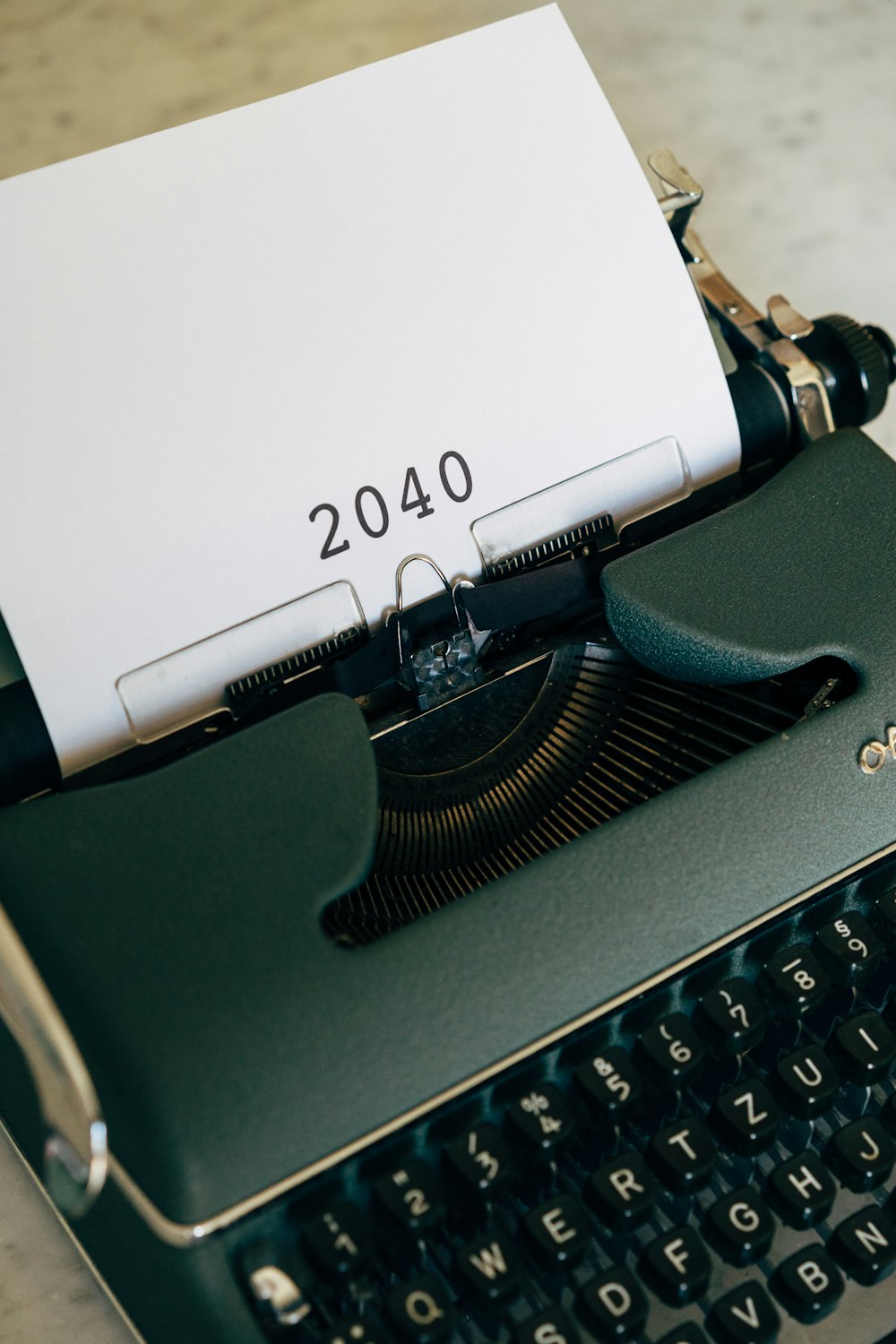 a typewriter with a sheet of paper on top of it