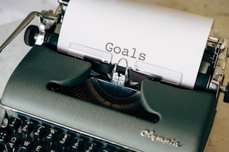 black and white typewriter on green textile