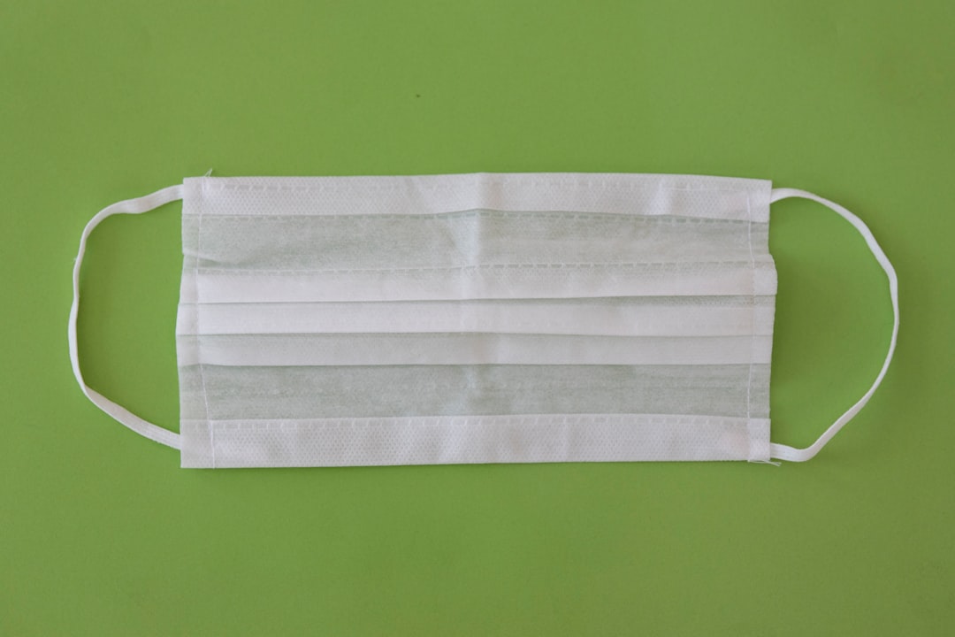 white towel on green surface