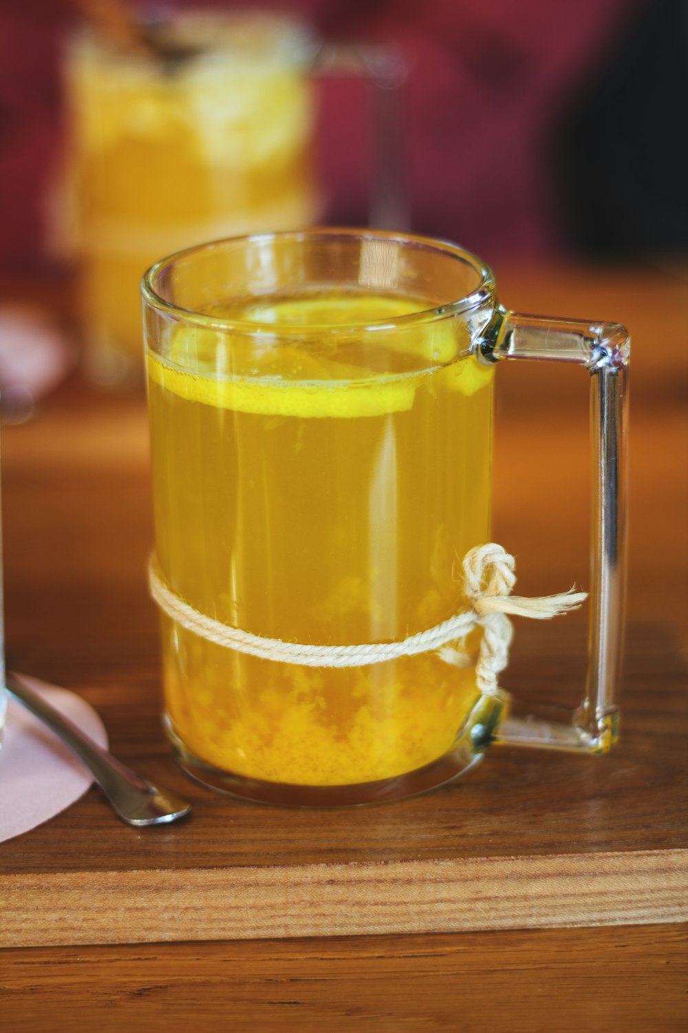 clear glass mug with yellow liquid
