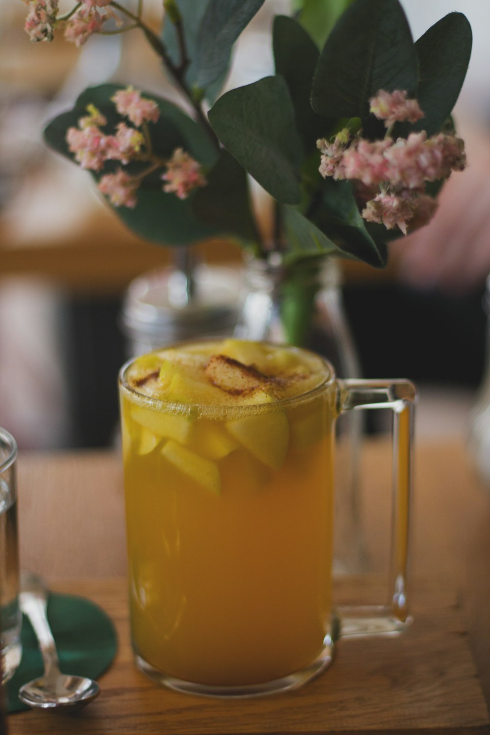 clear glass mug with yellow liquid