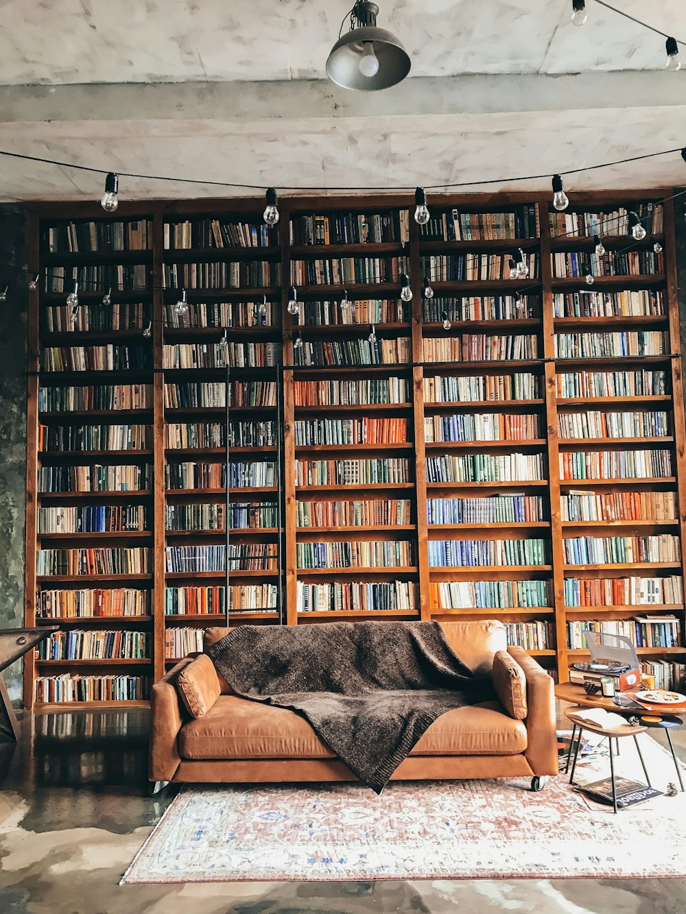 brown wooden book shelves with books