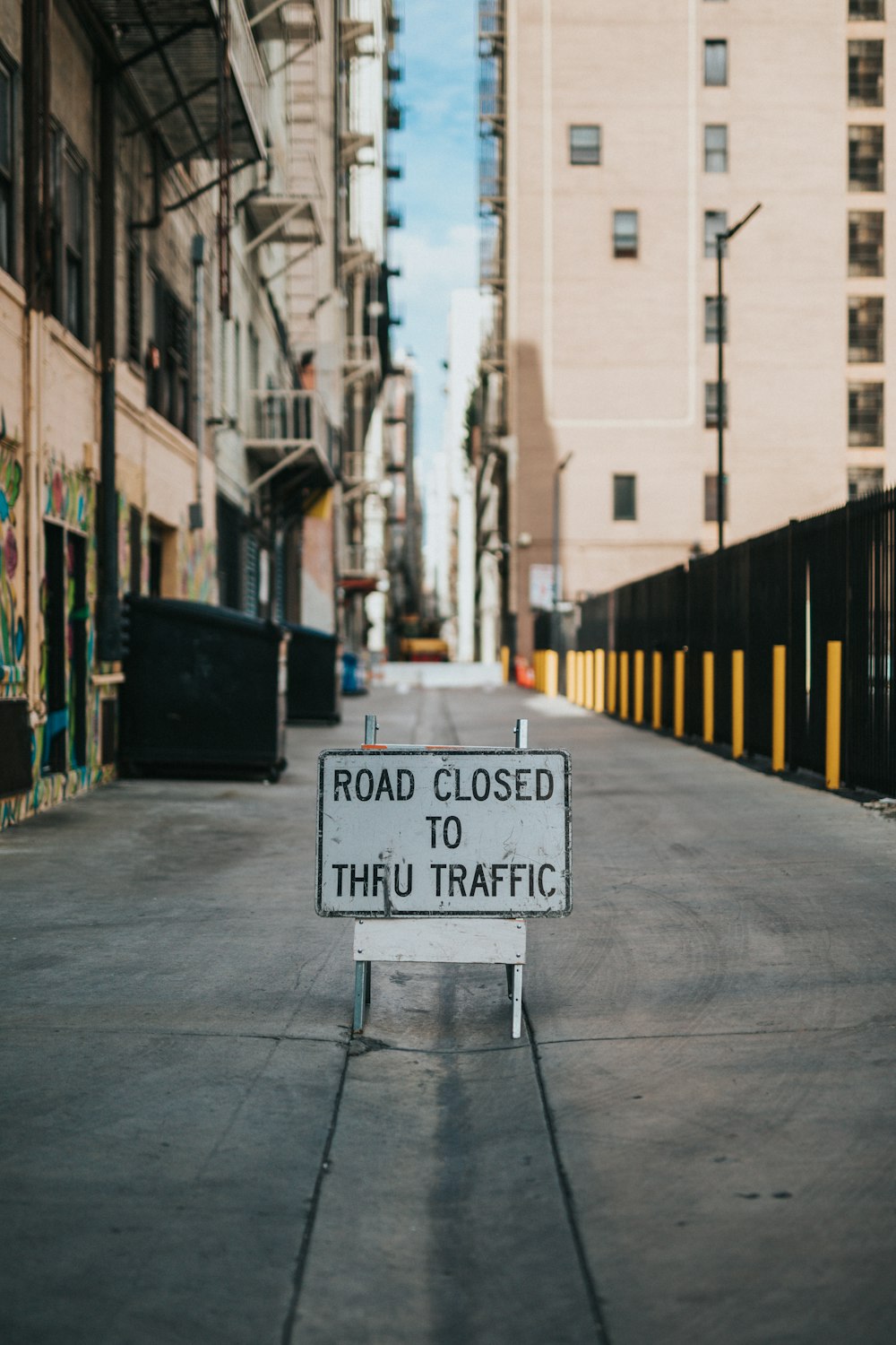 white and black road sign