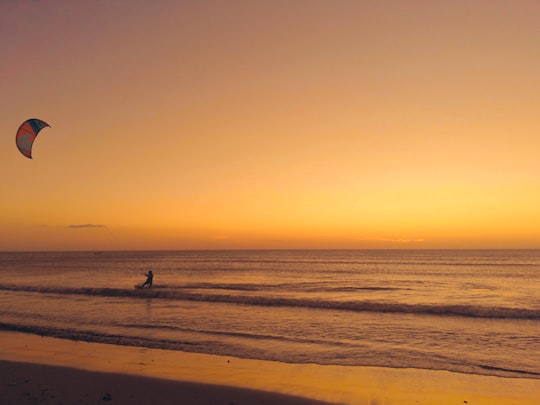 person walking on beach during sunset in Cabo de la Vela Colombia