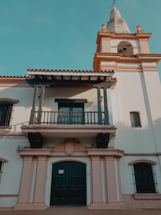 white and brown concrete building under blue sky during daytime