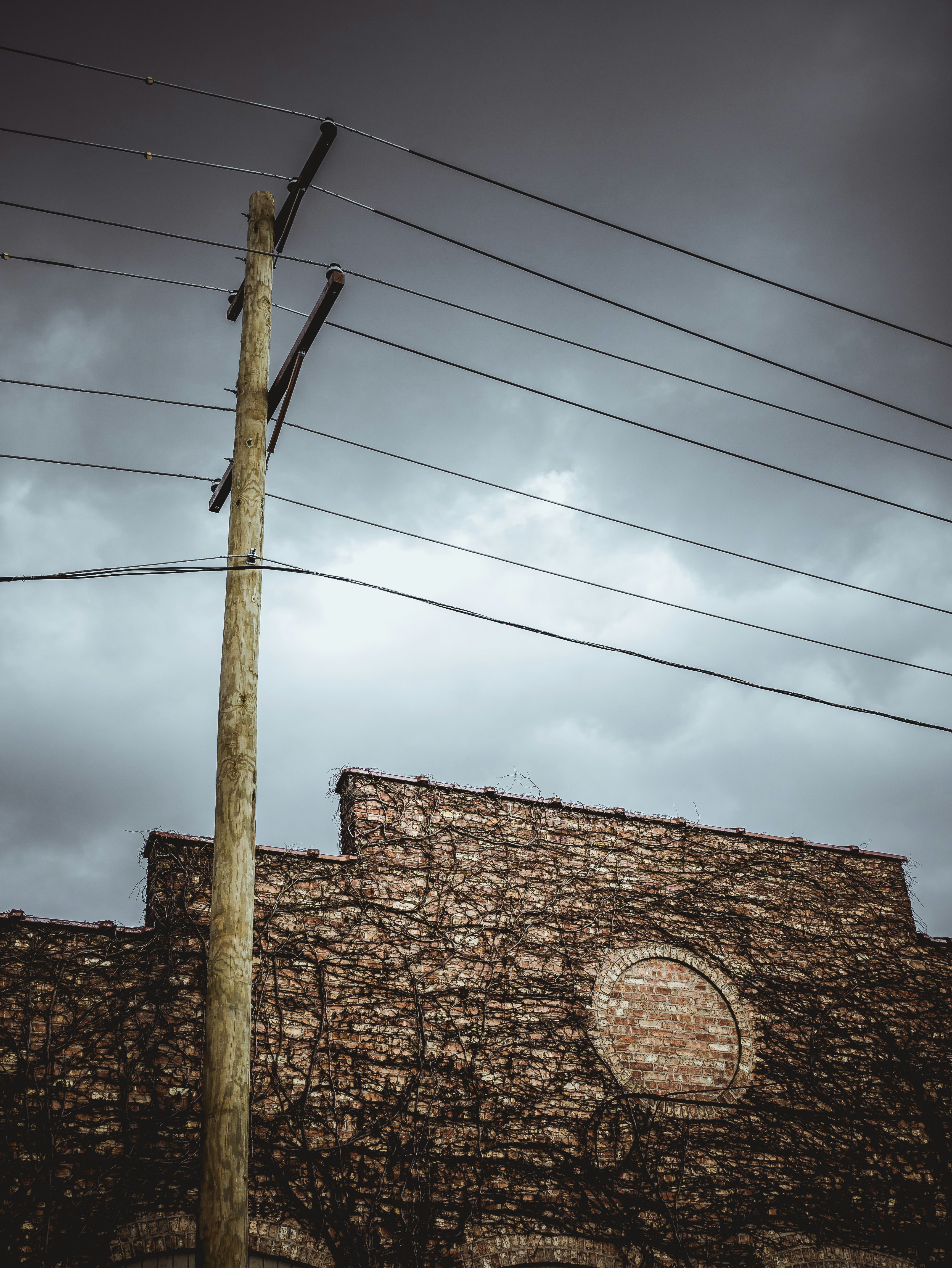 brown brick wall under blue sky during daytime