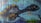 A colorful mural featuring a fantastical creature with a turtle-like shell and a long neck. The creature has large, expressive eyes and is set against an abstract underwater background. Bright colors and imaginative elements are evident throughout the artwork.