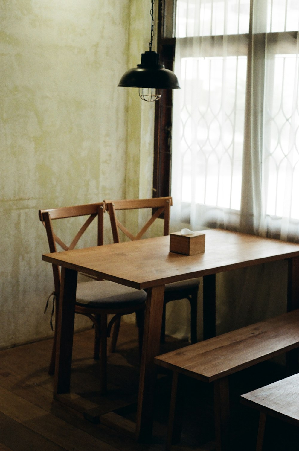 brown wooden table with chairs