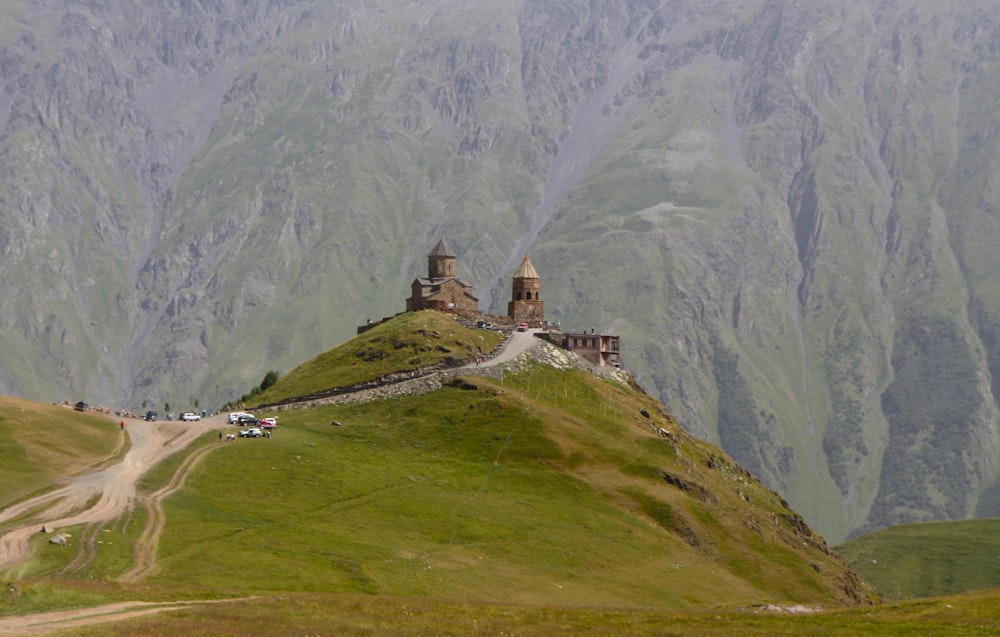 green grass covered mountain during daytime