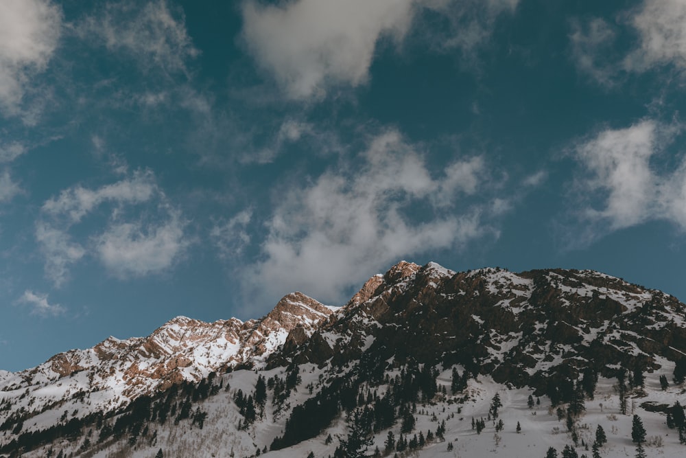 snow covered mountain under blue sky during daytime