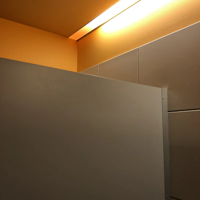 Minimalist interior space featuring clean lines and natural light with blue and yellow decor.