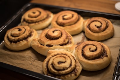 brown cookies on brown wooden tray rolls google meet background