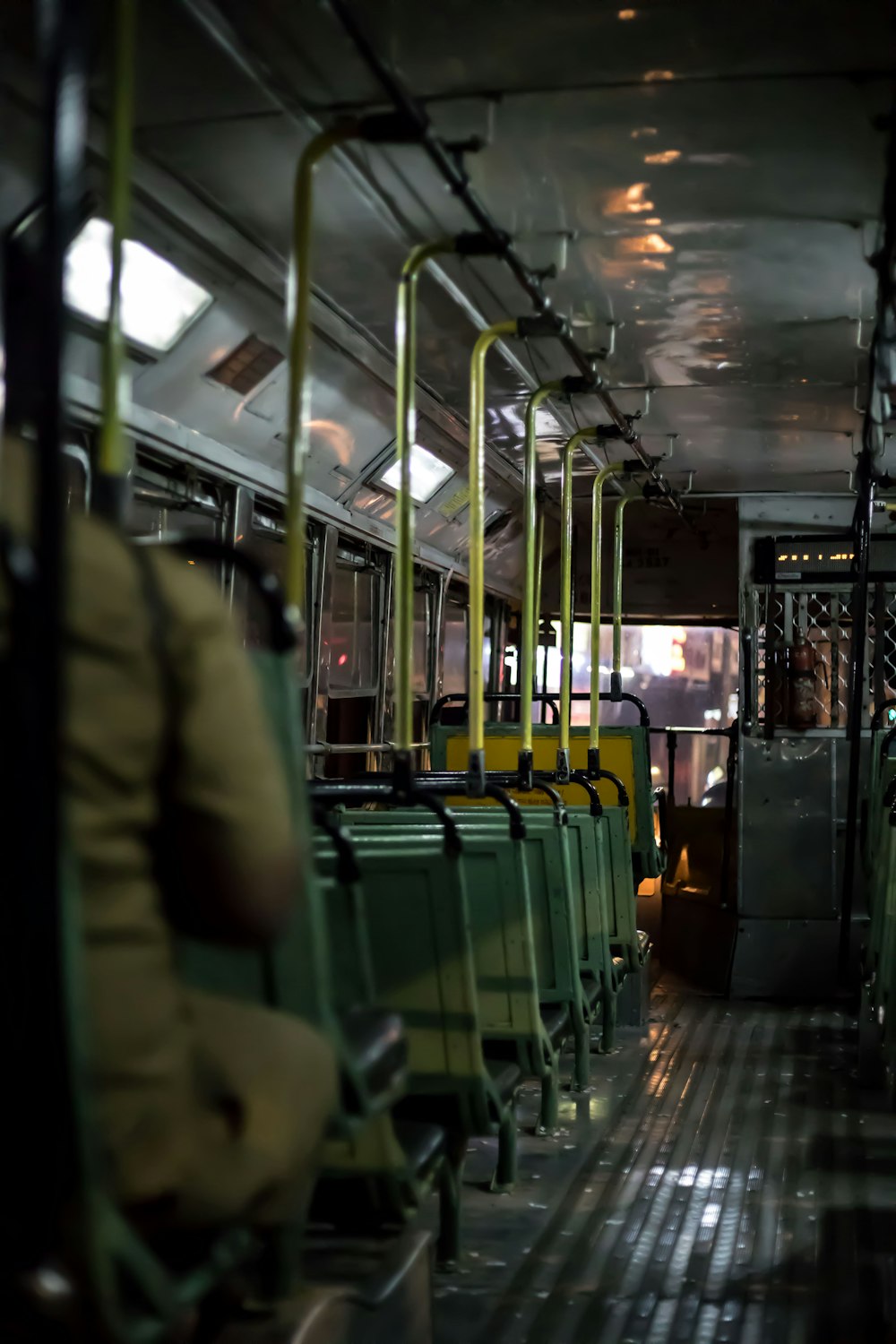 a bus filled with lots of green seats