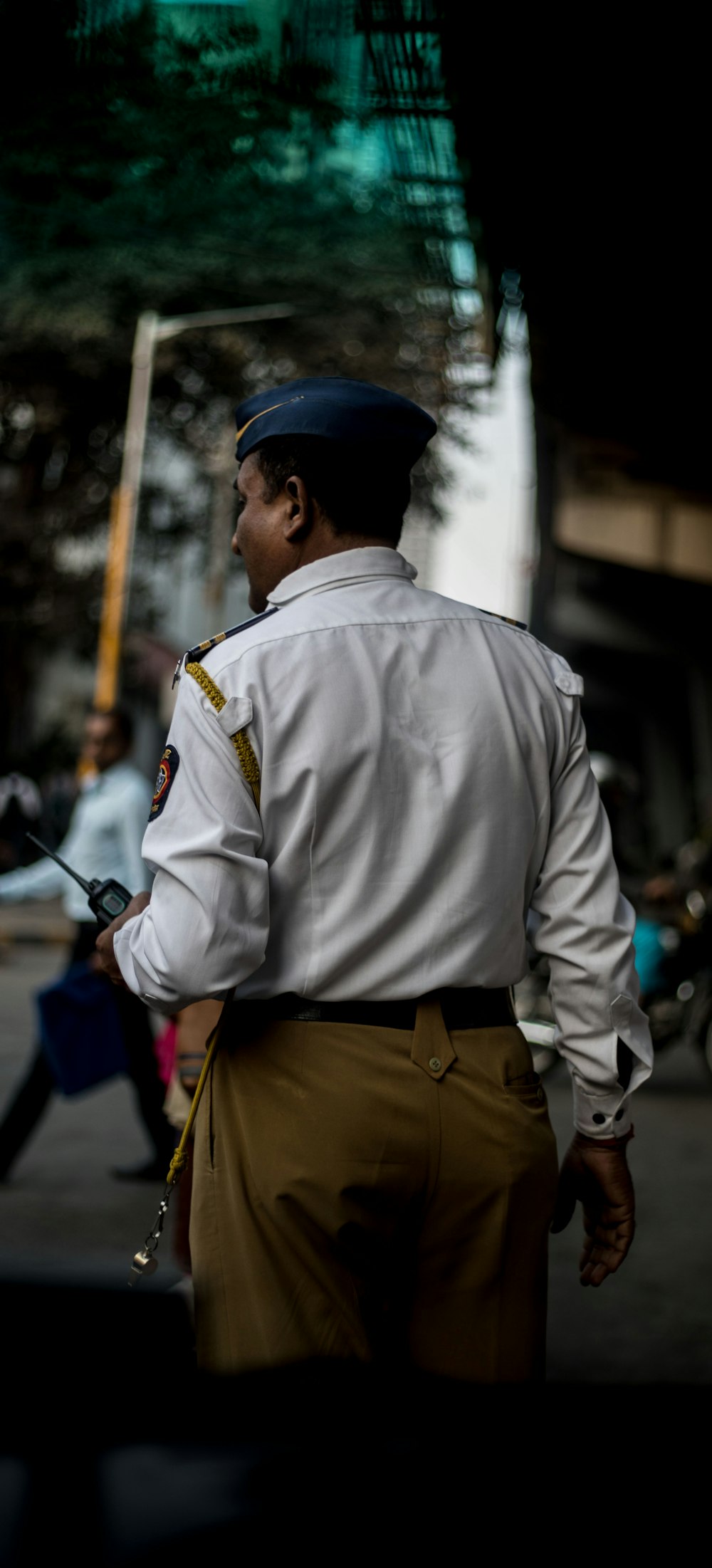 man in white long sleeve shirt and brown pants