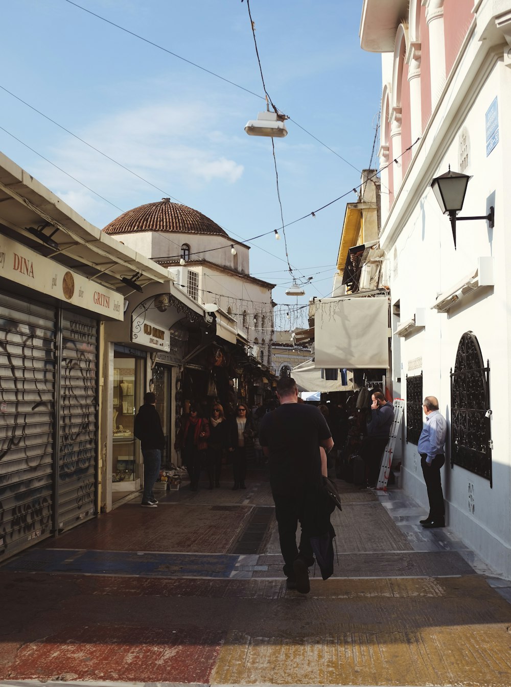 people walking on sidewalk during daytime