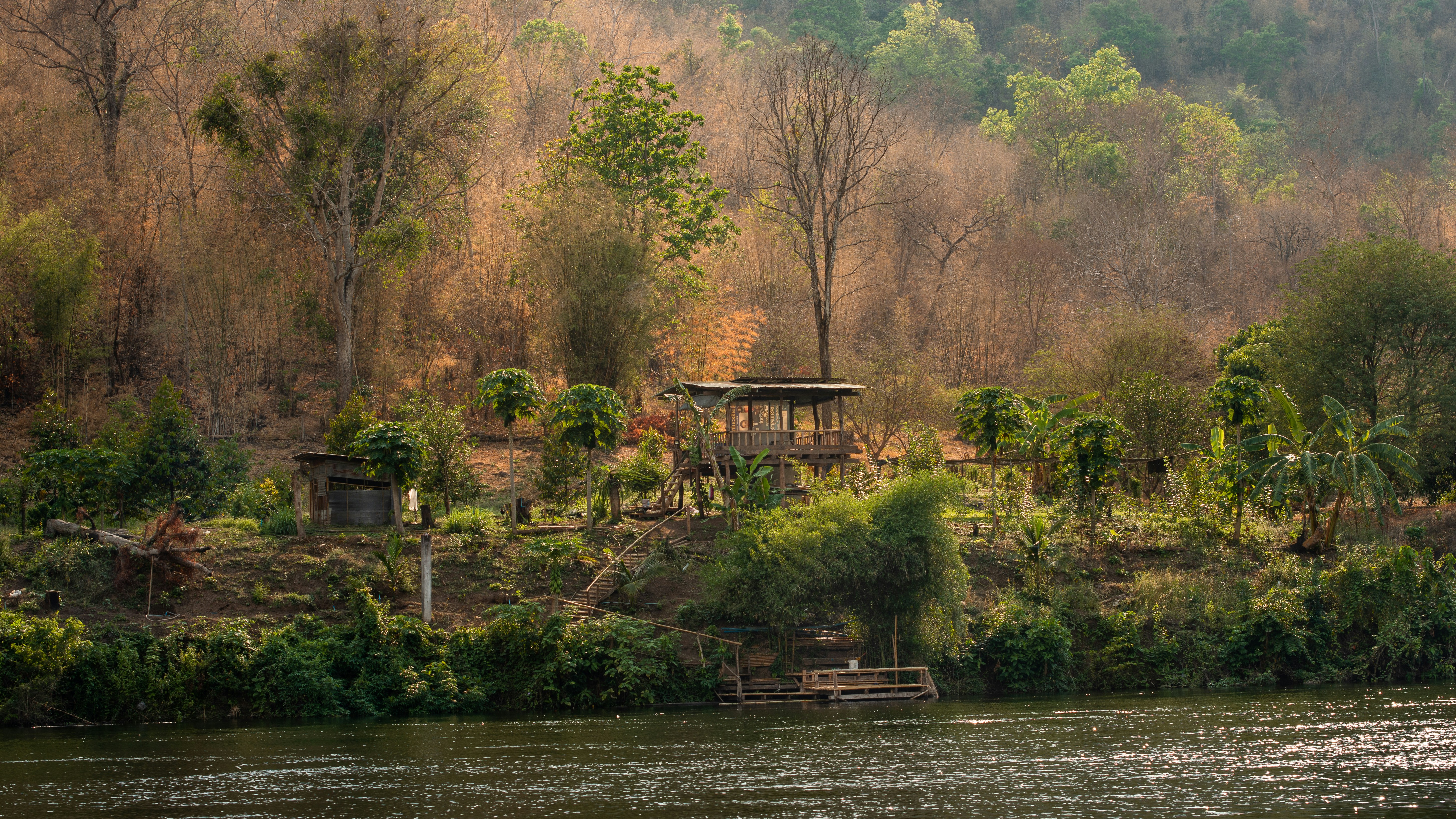 Brown wooden house near body of water during daytime photo – Free ...