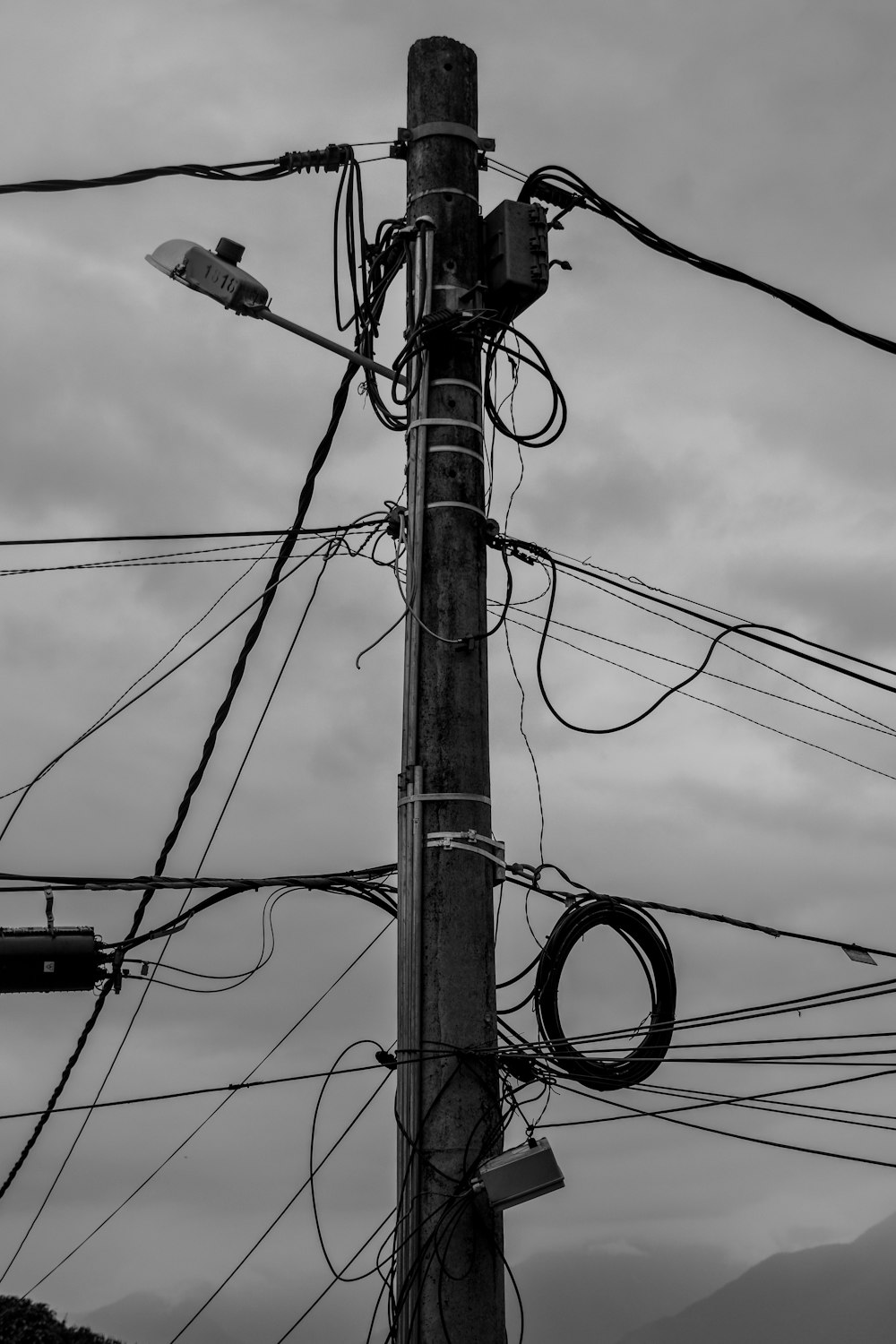 grayscale photo of electric post