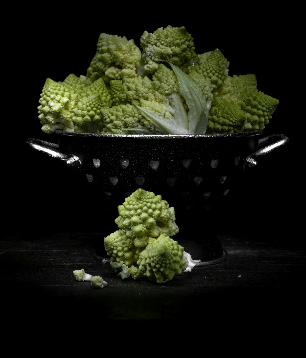 green broccoli on black ceramic bowl