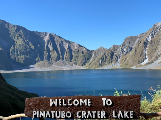 lake near mountain during daytime in Mount Pinatubo Philippines