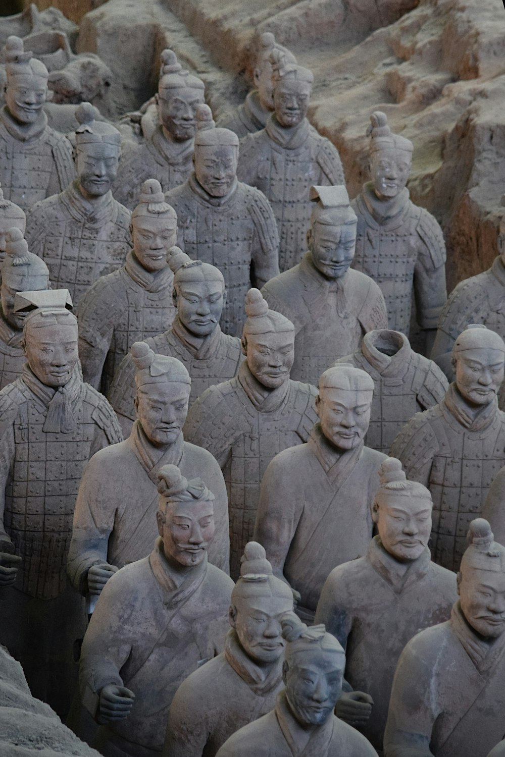 gray concrete statues during daytime