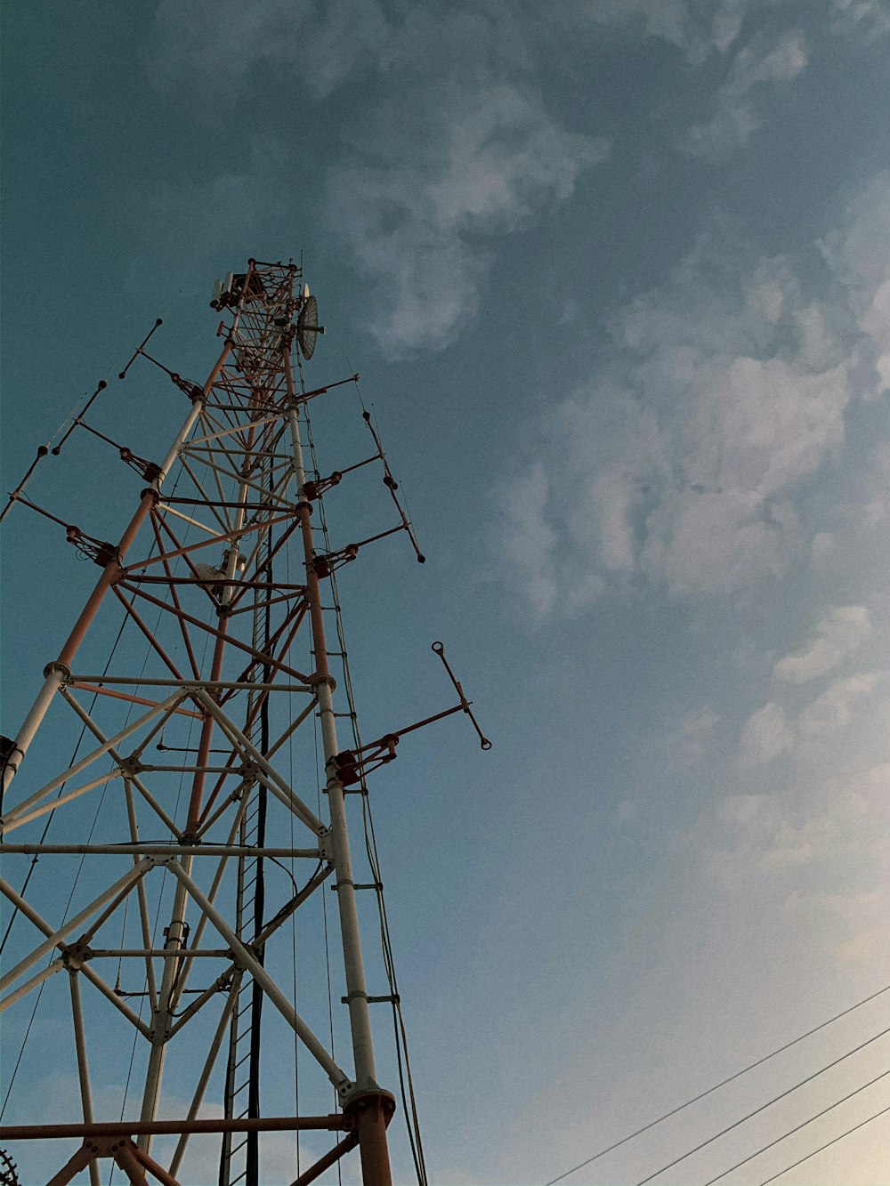 black and gray metal tower under blue sky